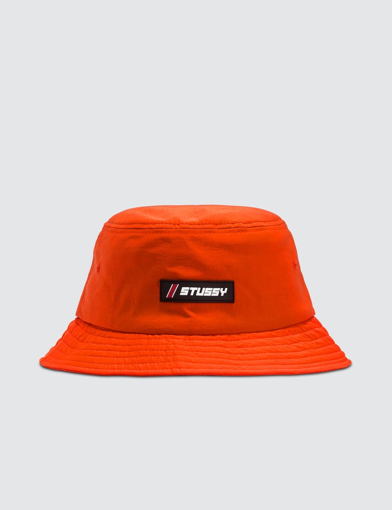 orange stussy bucket hat