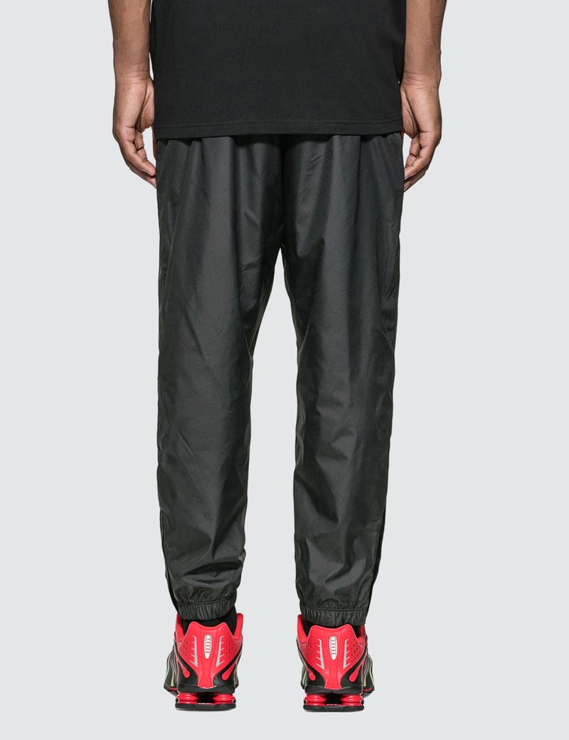atmos nike track pants