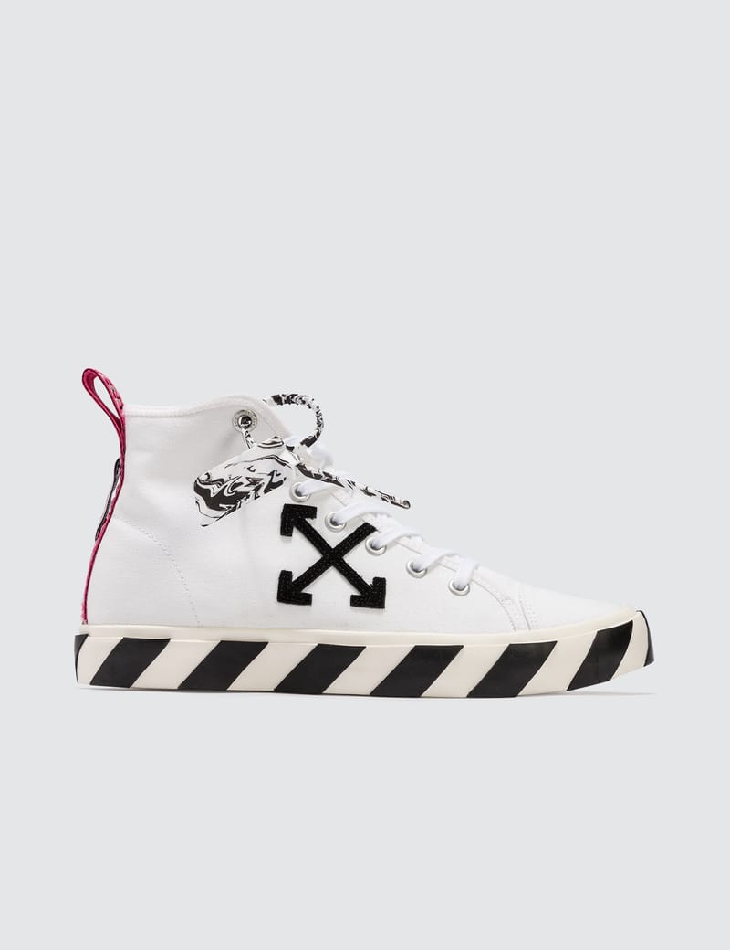white mid top sneakers