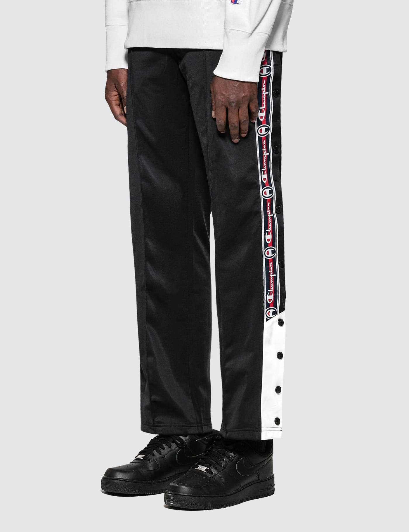 champion reverse weave popper taped track pant