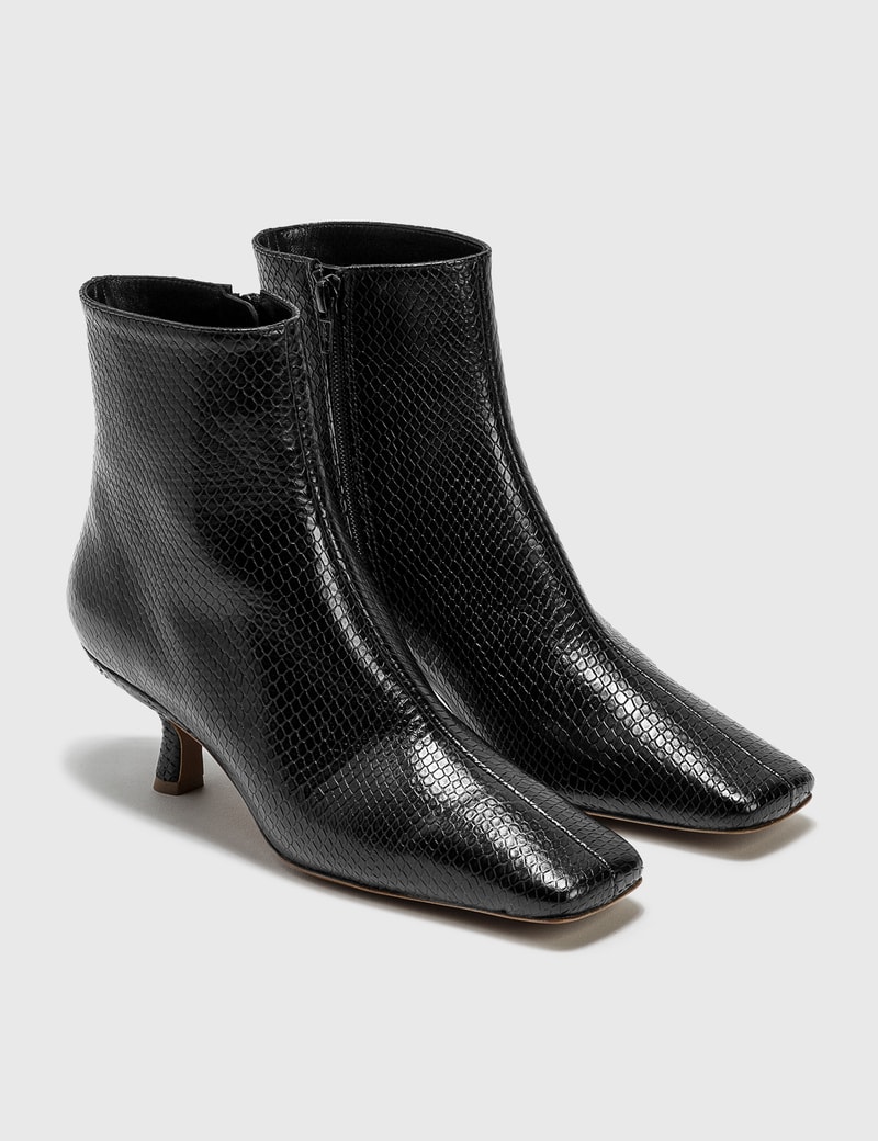Image of BY FAR Lange Black Snake Print Leather Boots