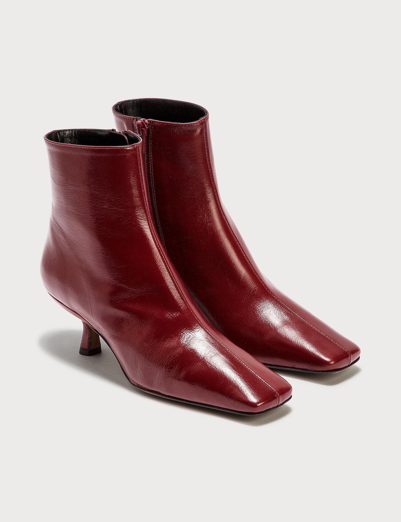 BY FAR LANGE BORDEAUX CREASED LEATHER BOOTS