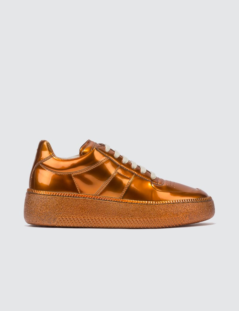 orange platform trainers