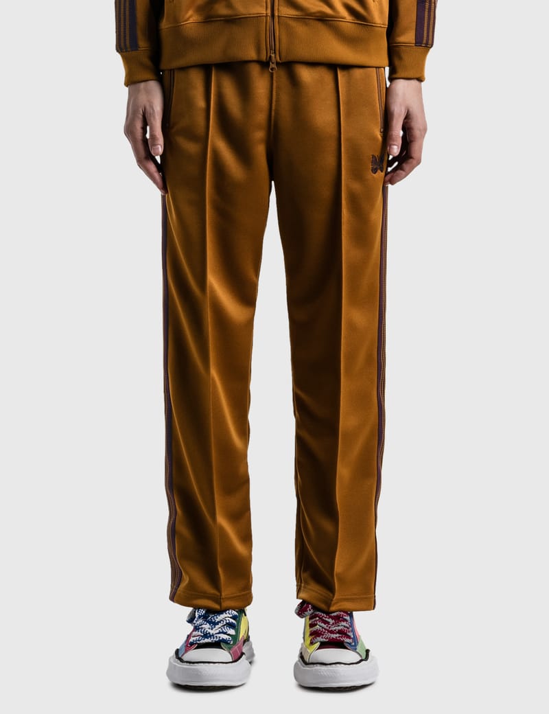 mustard track pants