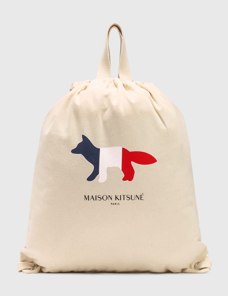 tote backpack resting fox