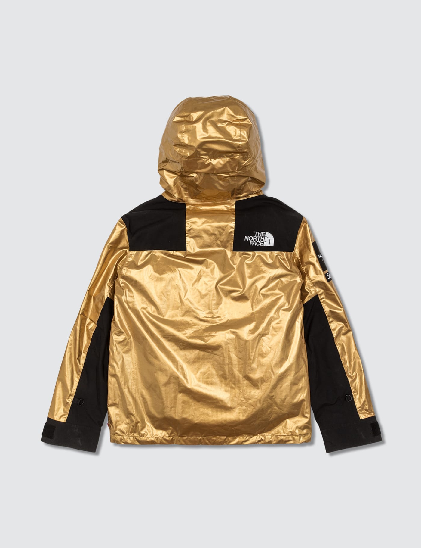 gold supreme north face jacket