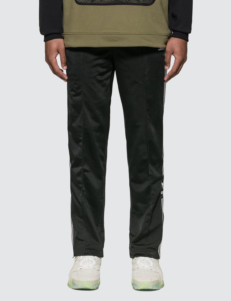 adidas originals three stripe track pants in khaki