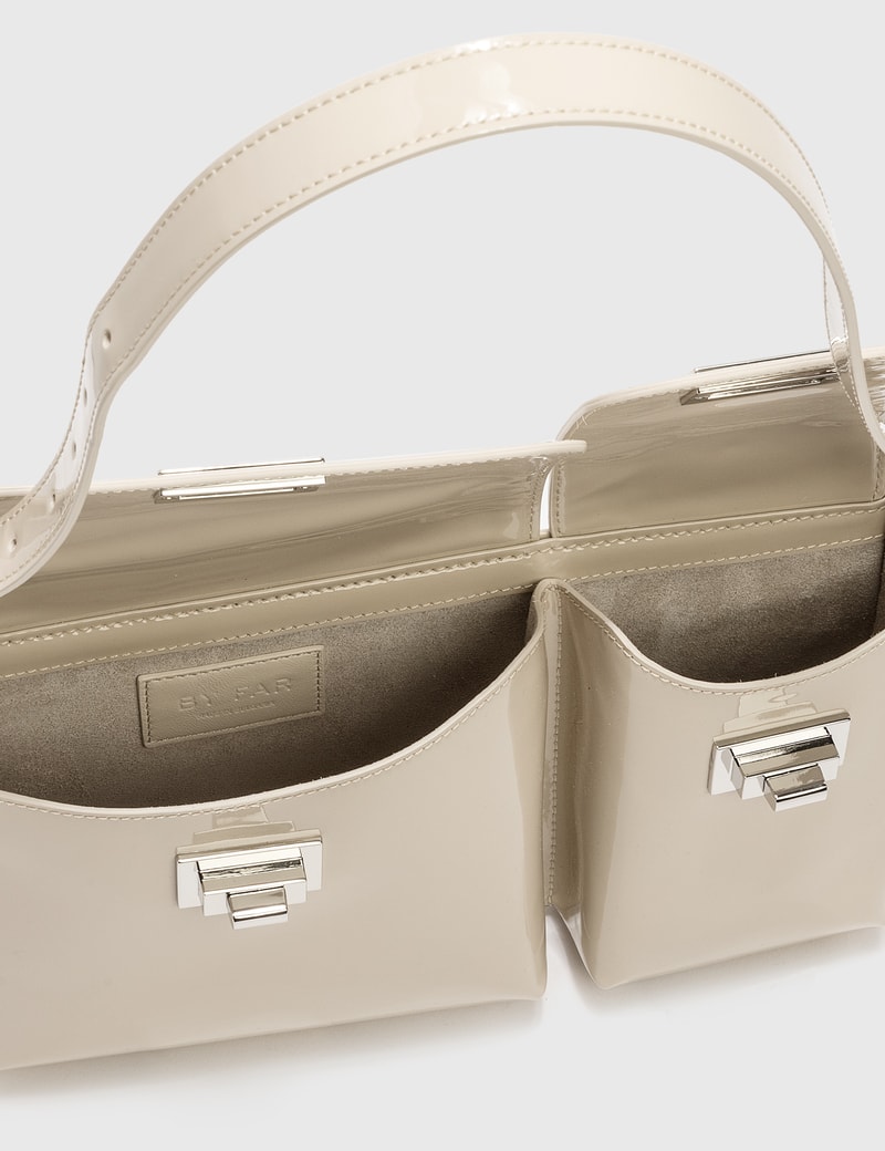 cream patent bag