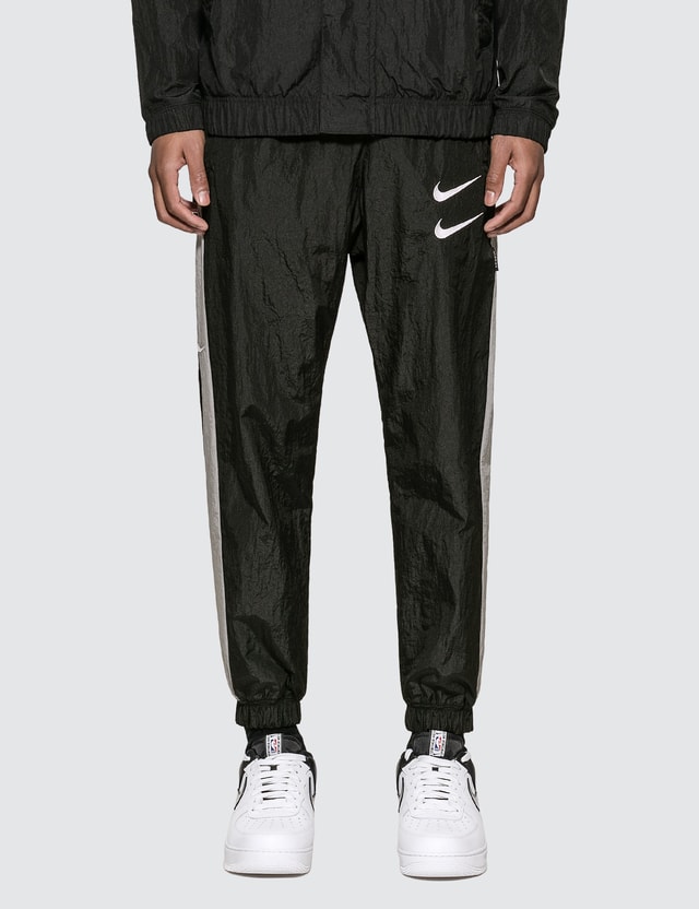 women's woven swoosh trousers