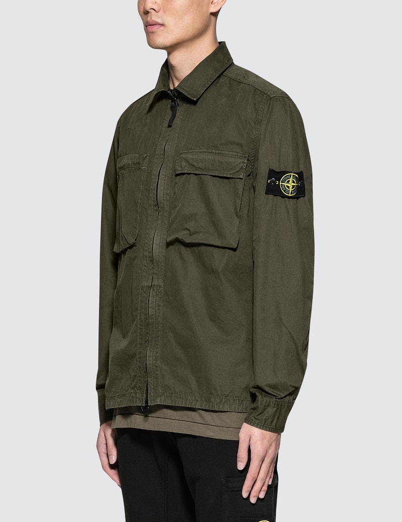 green stone island shirt