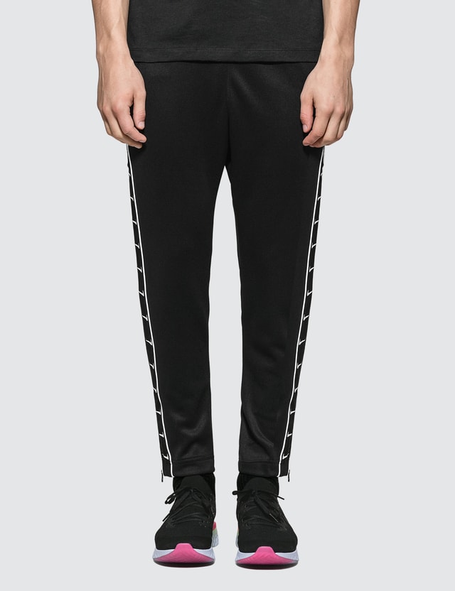 nike all over swoosh logo pants