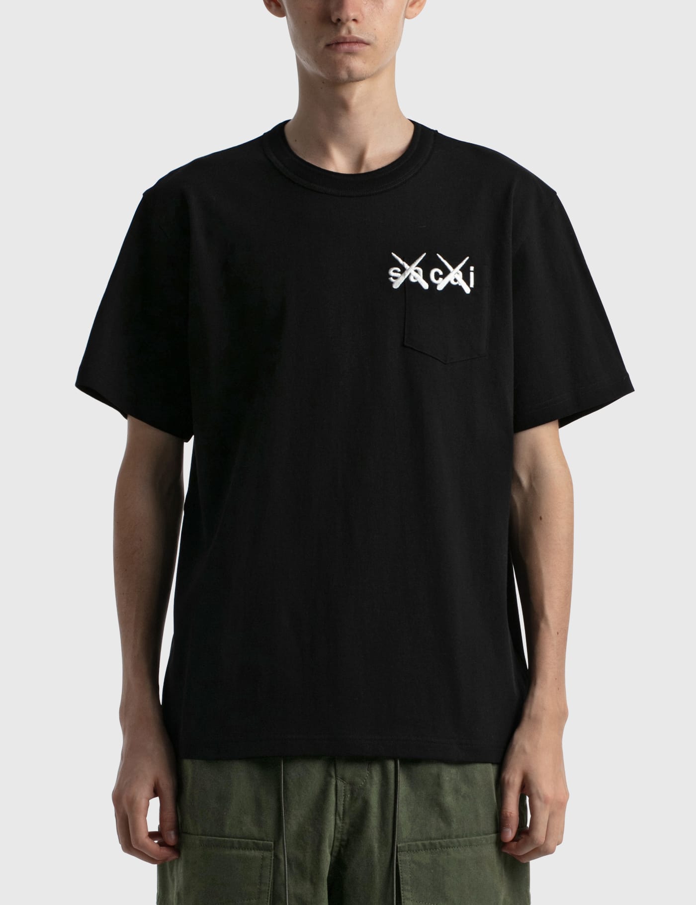 Sacai - KAWS Embroidery T-shirt | HBX - HYPEBEAST 為您搜羅全球潮流時尚品牌