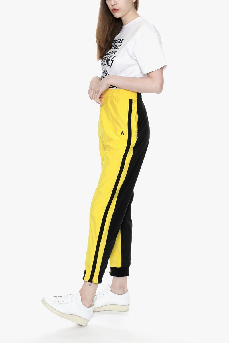 ambush joyce verbal yoon exclusive capsule tracksuit track jacket pants punk white sneakers yellow black tee tshirt