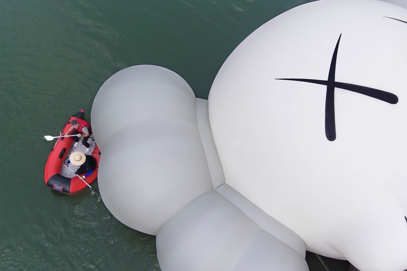 kaws holiday giant floating figure public art seokchon lake