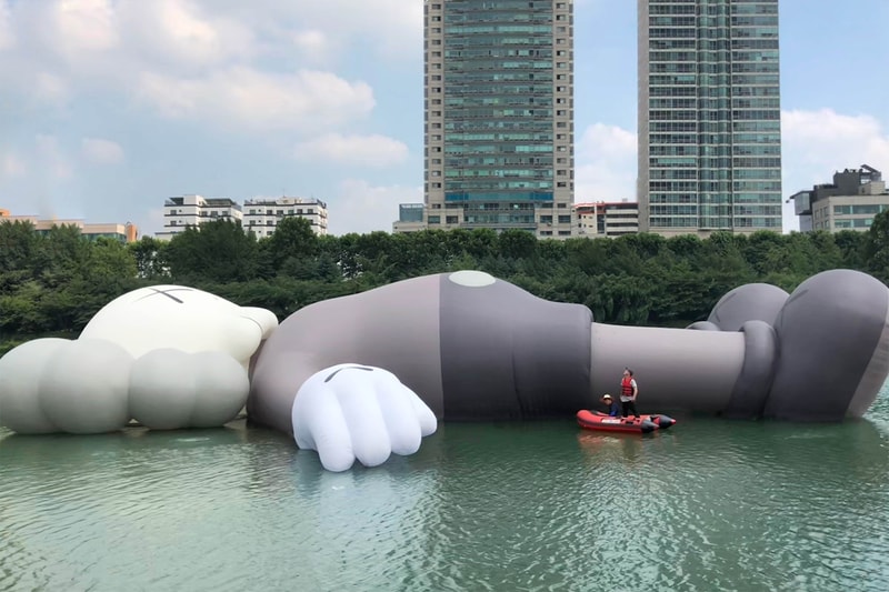 kaws holiday giant floating figure public art seokchon lake