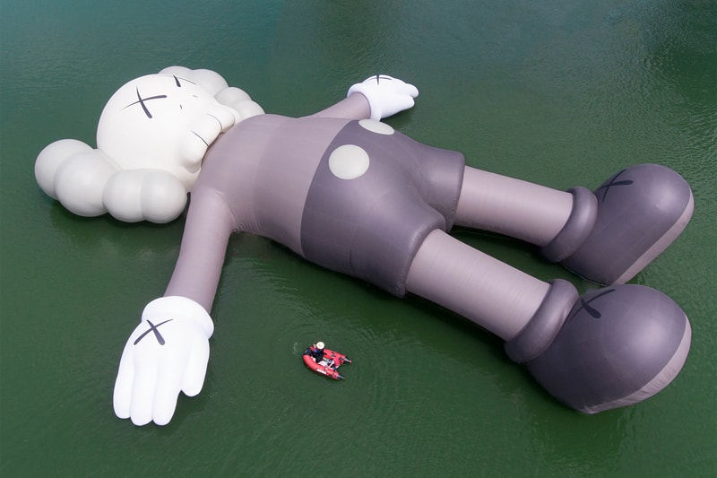kaws holiday giant floating figure public art seokchon lake