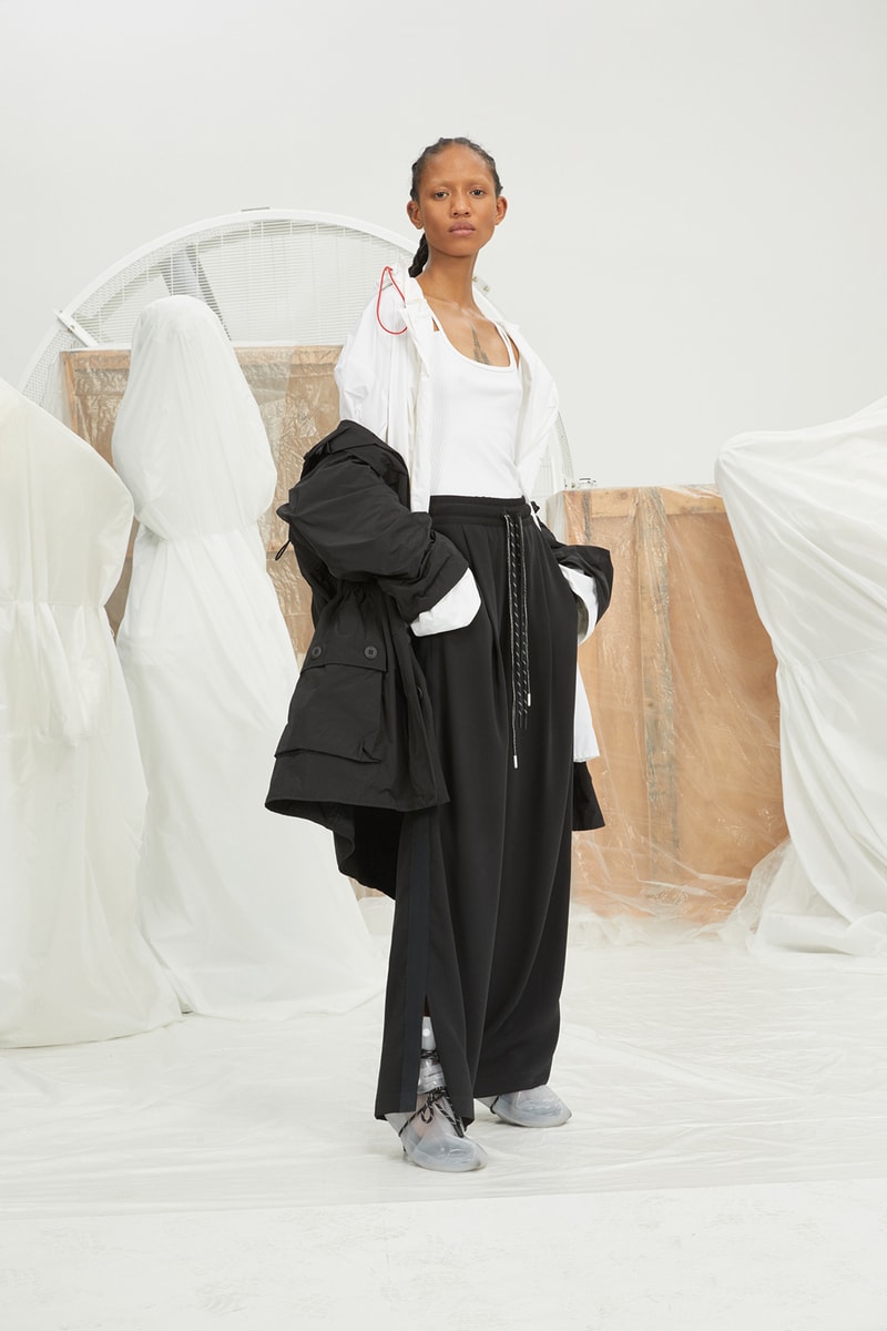 perfect number woman on pedastal Adesuwa Aighewi black and white jacket shirt pants