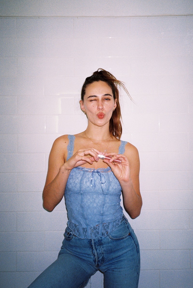 Devon Lee Carlson Jeans 90s Blue Ponytail Makeup Skincare Routine Beauty Model Wildflower Cases Co-Founder Lip Gloss