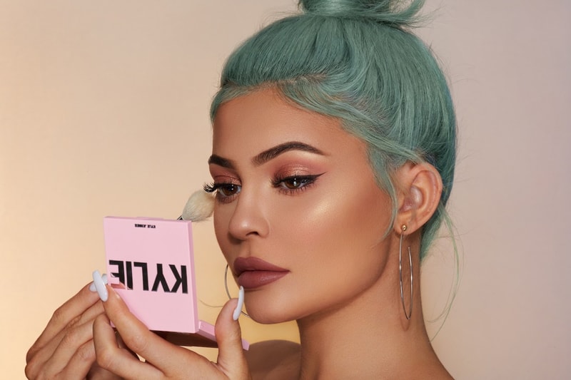 kylie jenner cosmetics eyeshadow palette makeup brush blue hair lipstick foundation hoop earrings 
