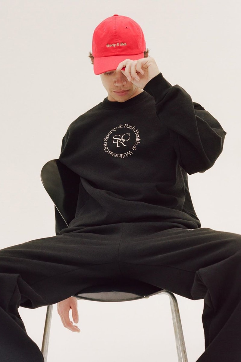 Emily Oberg Sporty & Rich Drop 3 Red Dad Cap Logo Health and Wellness Club Sweater Sweatshirt Crewneck Black Sweatpants Men Male Model
