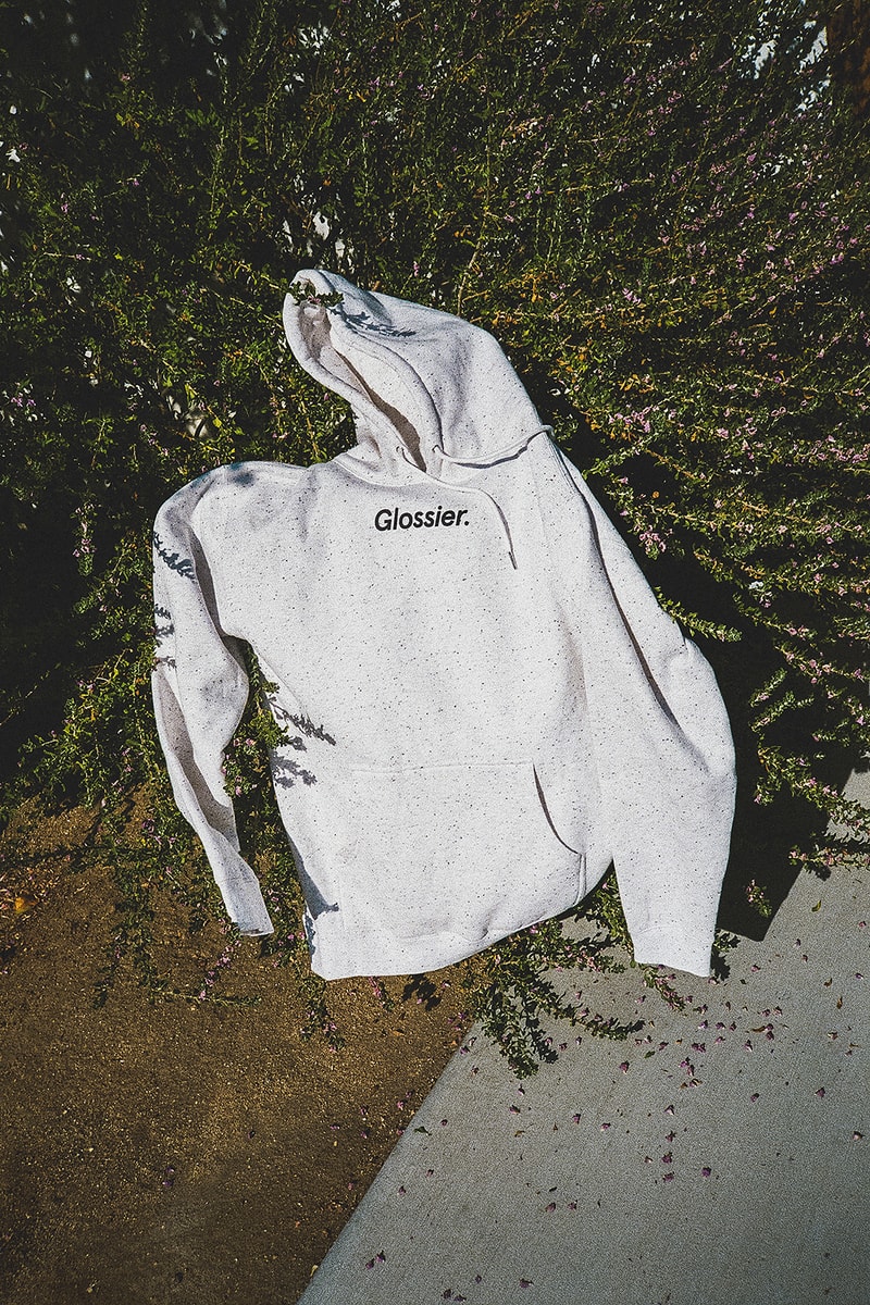 glossier glossiwear limited edition terrazzo hoodie gray sneaker white duffle bag