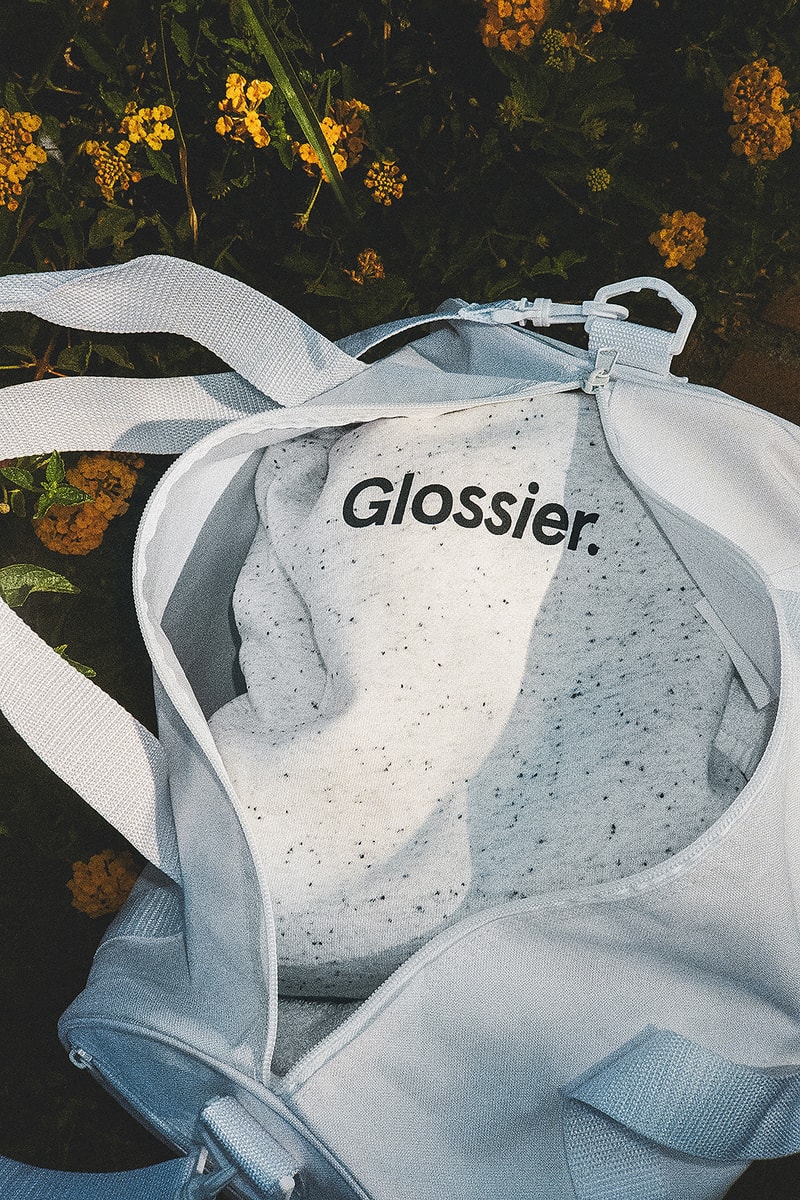 glossier glossiwear limited edition terrazzo hoodie gray sneaker white duffle bag
