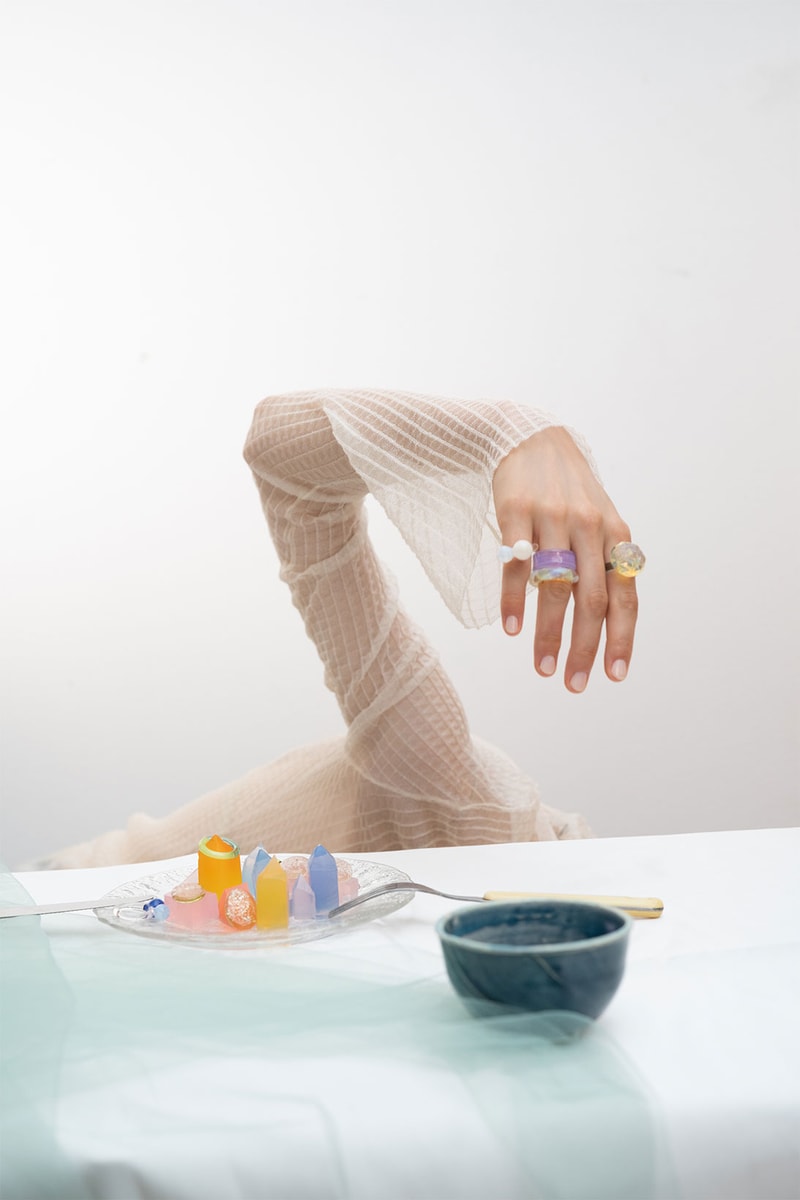 keane brooklyn glass jewelry brand rings hand long sleeved white shirt