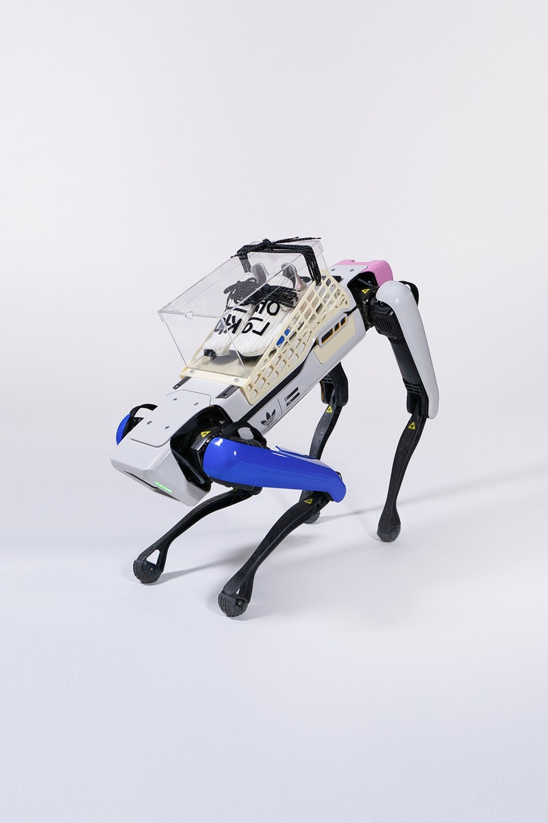 pharrell williams adidas originals hu nmd cream sneakers robot campaign legs display