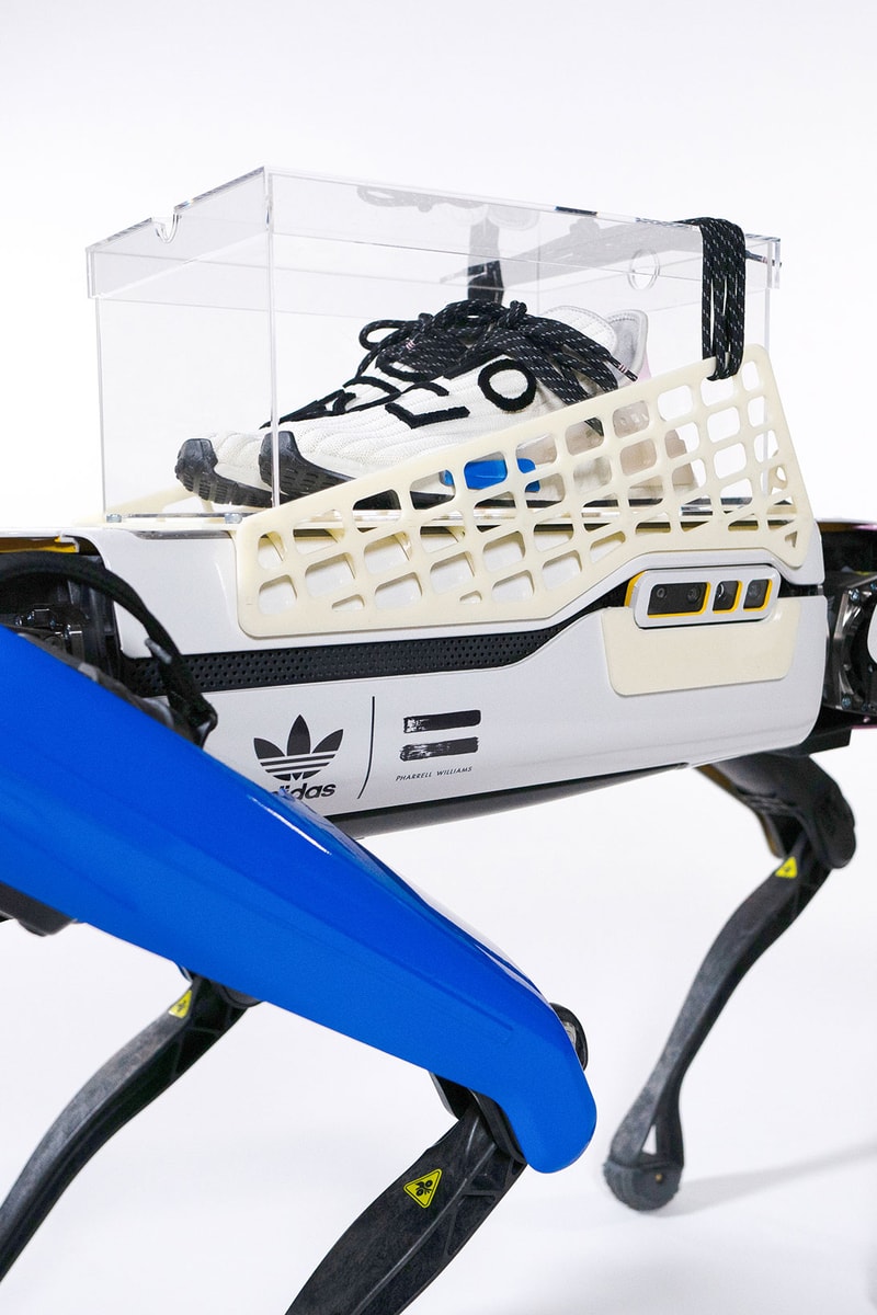 pharrell williams adidas originals hu nmd cream sneakers robot campaign side acrylic box logo branding