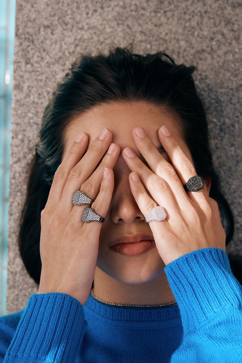 numbering jewelry hands covering face signet rings