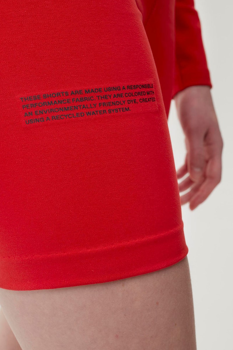 pangaia roica stretch athleisure sustainable collection turtleneck top bike shorts red