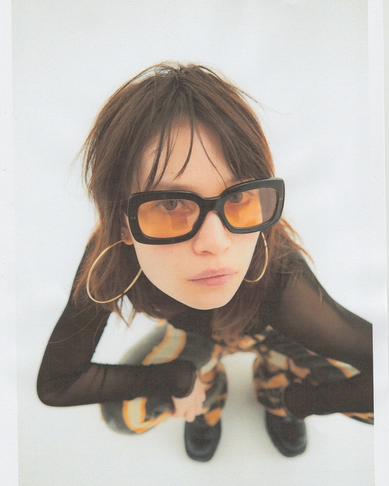 lexxola antonio sunglasses black frames orange tinted hoop earrings