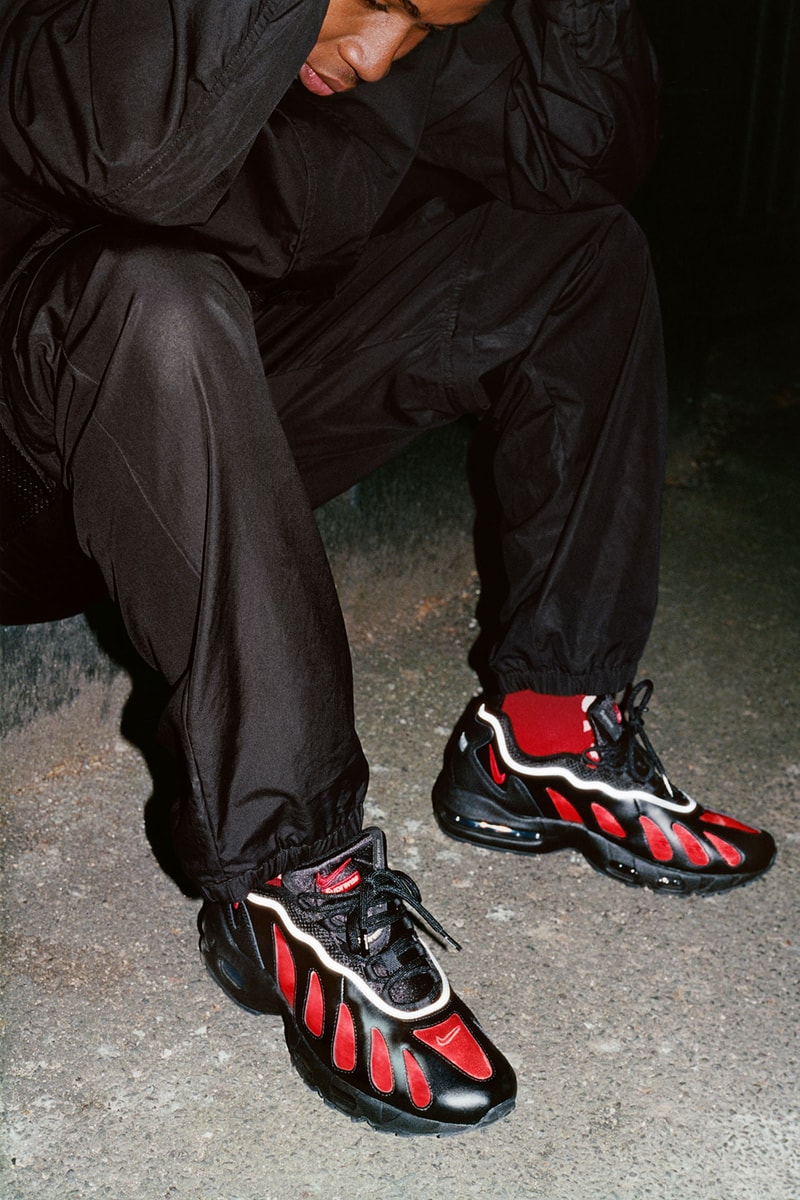 supreme nike air max am96 sneakers collaboration black on-foot red socks