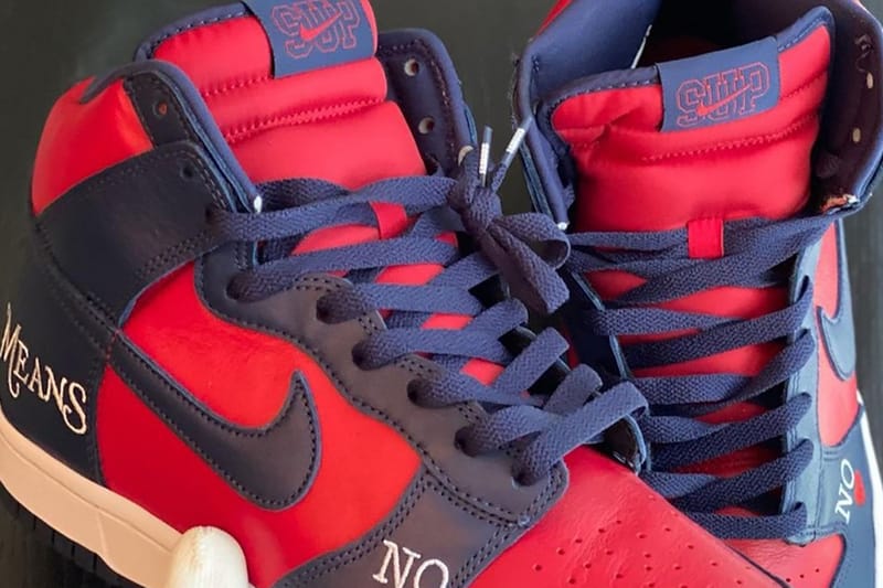 Images of Supreme x Nike's SB Dunk High "By Any Means" in Navy and Red Surface