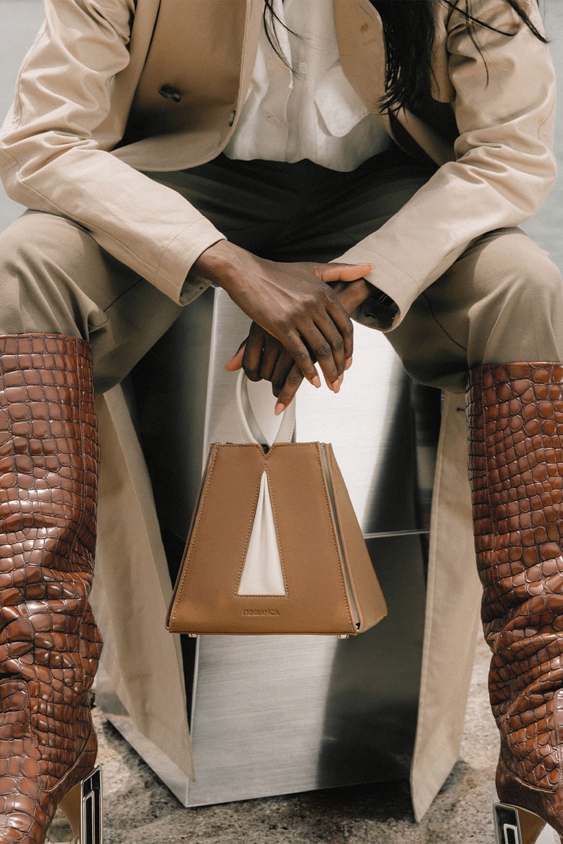 Noiranca Brown Bag on model sitting in desert
