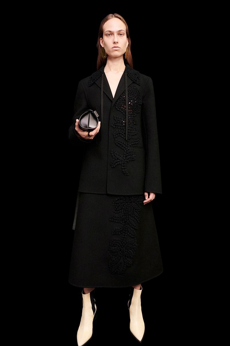 jil sander women's pre-fall 2022 collection black overcoat white boots