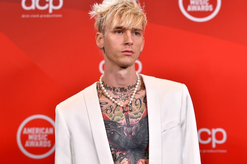 machine gun kelly mgk colson baker event red carpet white outfit blonde hair nail polish tattoos