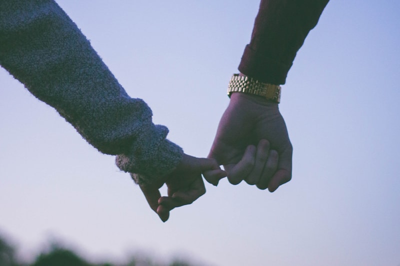 Man and woman holding hands shot on film