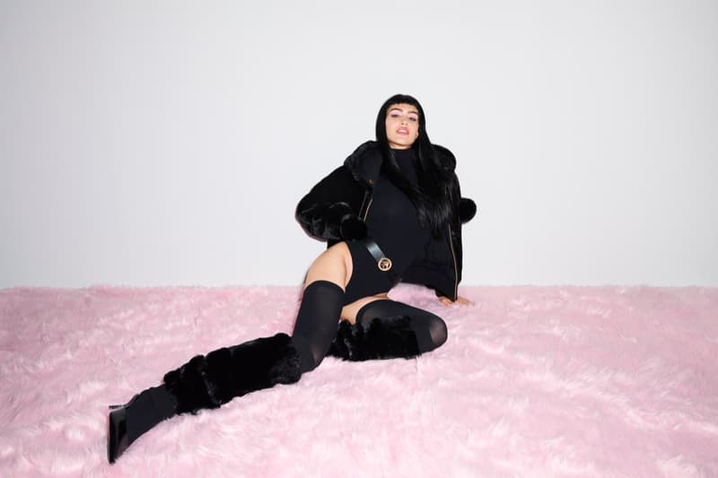 amelia gray girl laying on bed jacket fur pink legs shoes