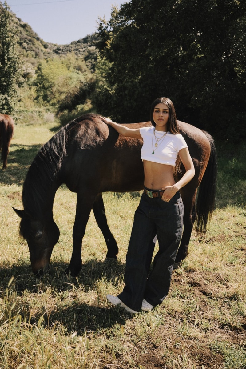 salomon ama lou girl musician singer crop top jeans horse sneakers shoes