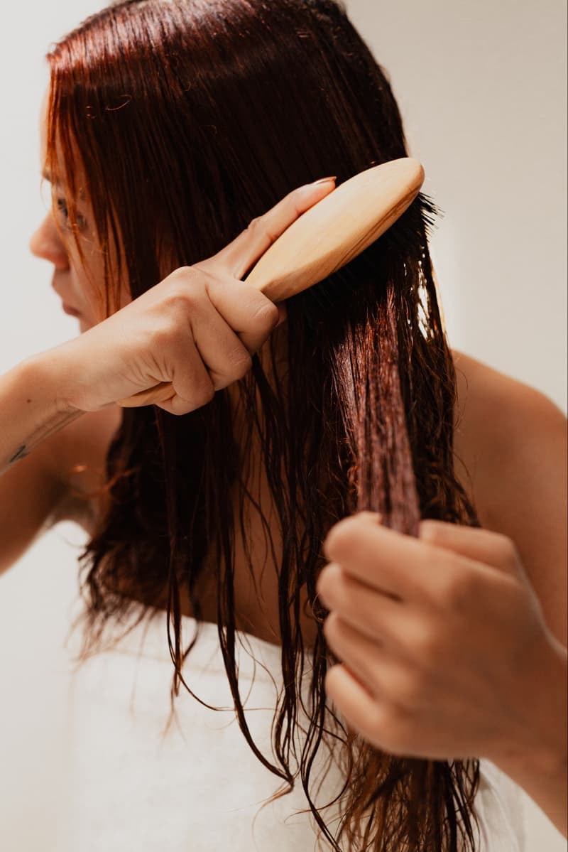luxury haircare, woman using luxury hairbrush on red hair, beauty, altesse studio