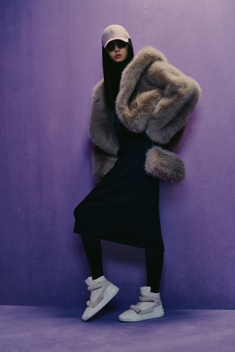 naomi campbell boss girl boy hat fluffy pink coat fur lilac background
