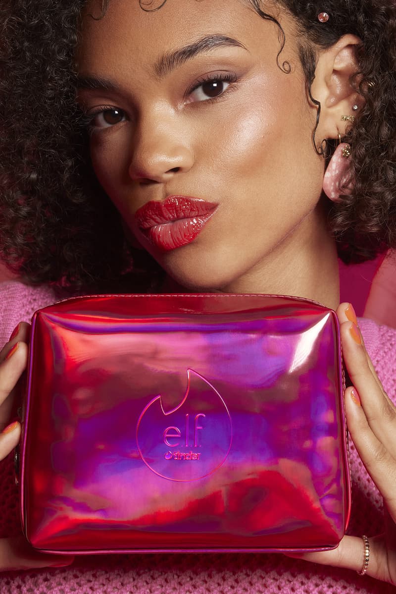 woman applying lip gloss in a red room, tinder and e.l.f. cosmetics collab, makeup, beauty