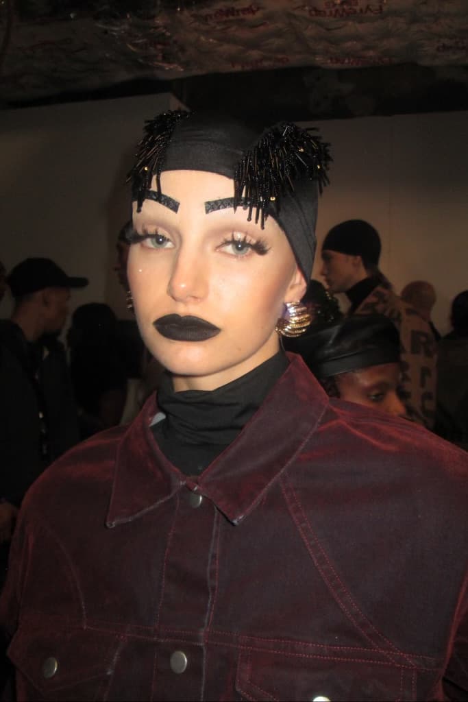 woman with sculpted, gel hair getting her makeup done, luar, ss25, fashion week, tresemme, mac cosmetics