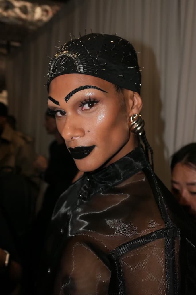 woman with sculpted, gel hair getting her makeup done, luar, ss25, fashion week, tresemme, mac cosmetics