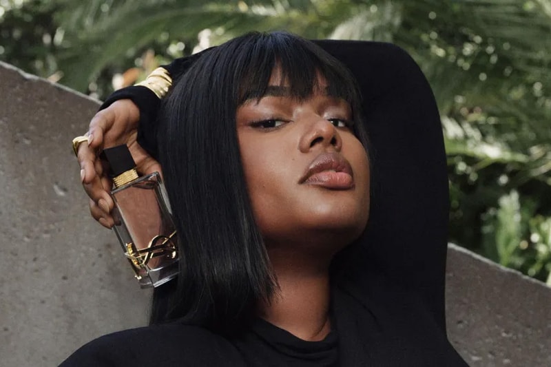 precious lee model posing with bottle of new yves saint laurent perfume, ysl, fragrance, beauty, dua lipa