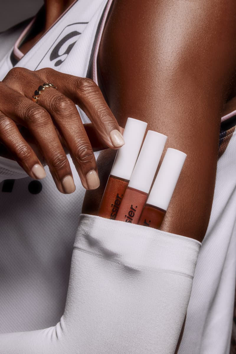 women sitting down posing with basketballs, wnba, glossier lip gloss, beauty, makeup