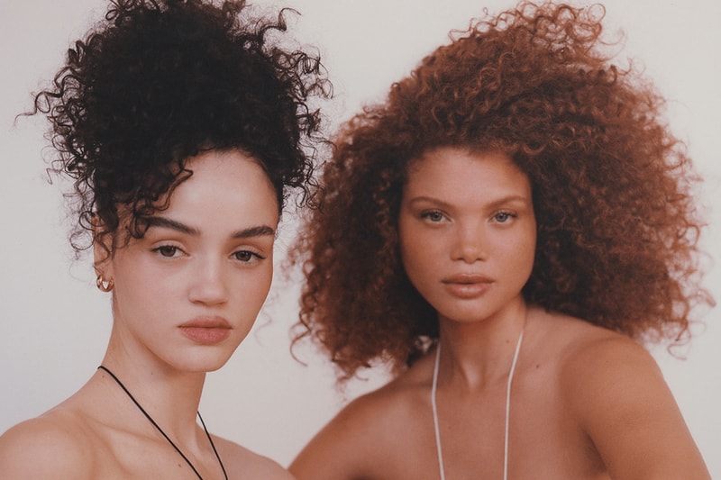 two women with curly hair posing, hair gloss, skincare, haircare, beauty trends