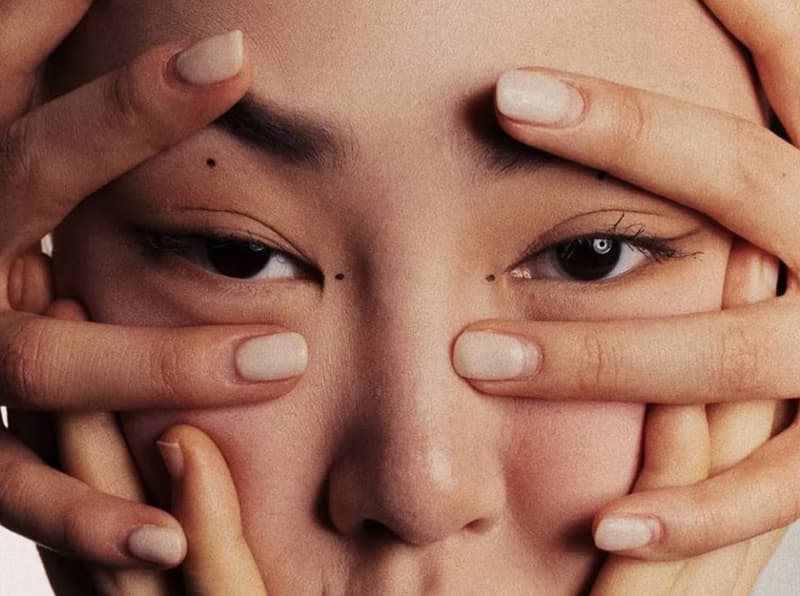 woman with hands on her face, emmys, facial, skincare, joanna vargas, we tried it, celebrity treatments