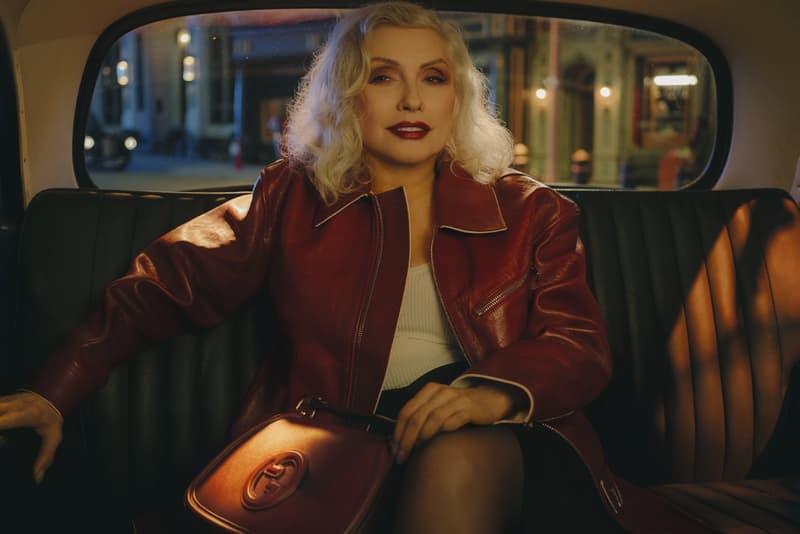 gucci blondie kelsey lu woman body red background suede brown bag